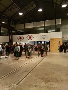 People walk around a large open space at Carriageworks, an industrial art space