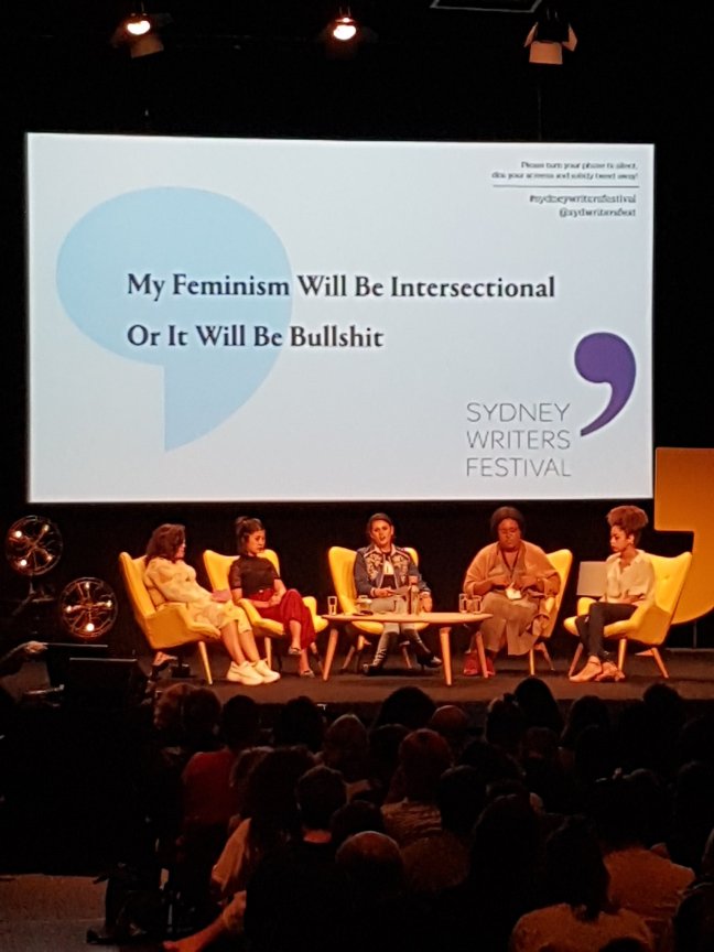 Five women panellists it on stage. Title reads: My feminism will be intersectional or it will be bullshit